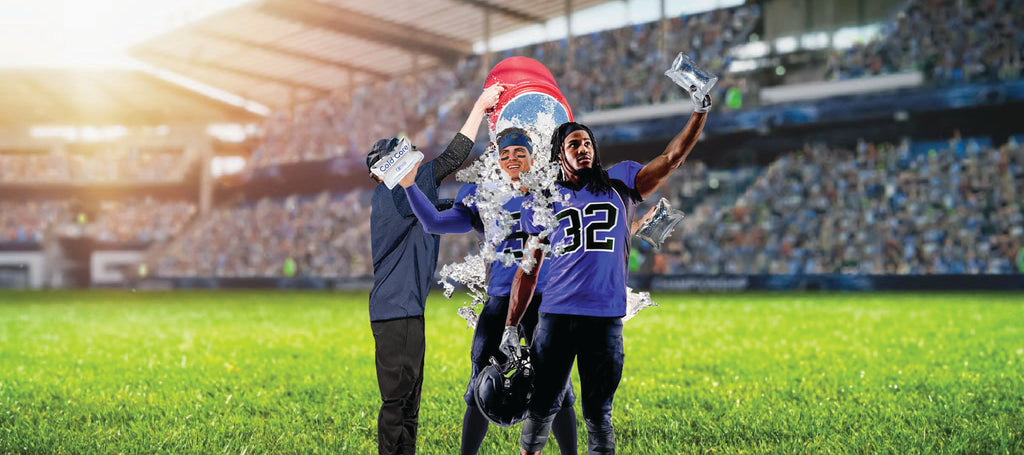 Two happy professional male football players celebrate after winning an NFL game with Krazy Kool Technology Cold Core therapy ice packs in their hands, while a coach/member of their team pours a Gatorade ice bucket on their heads.
