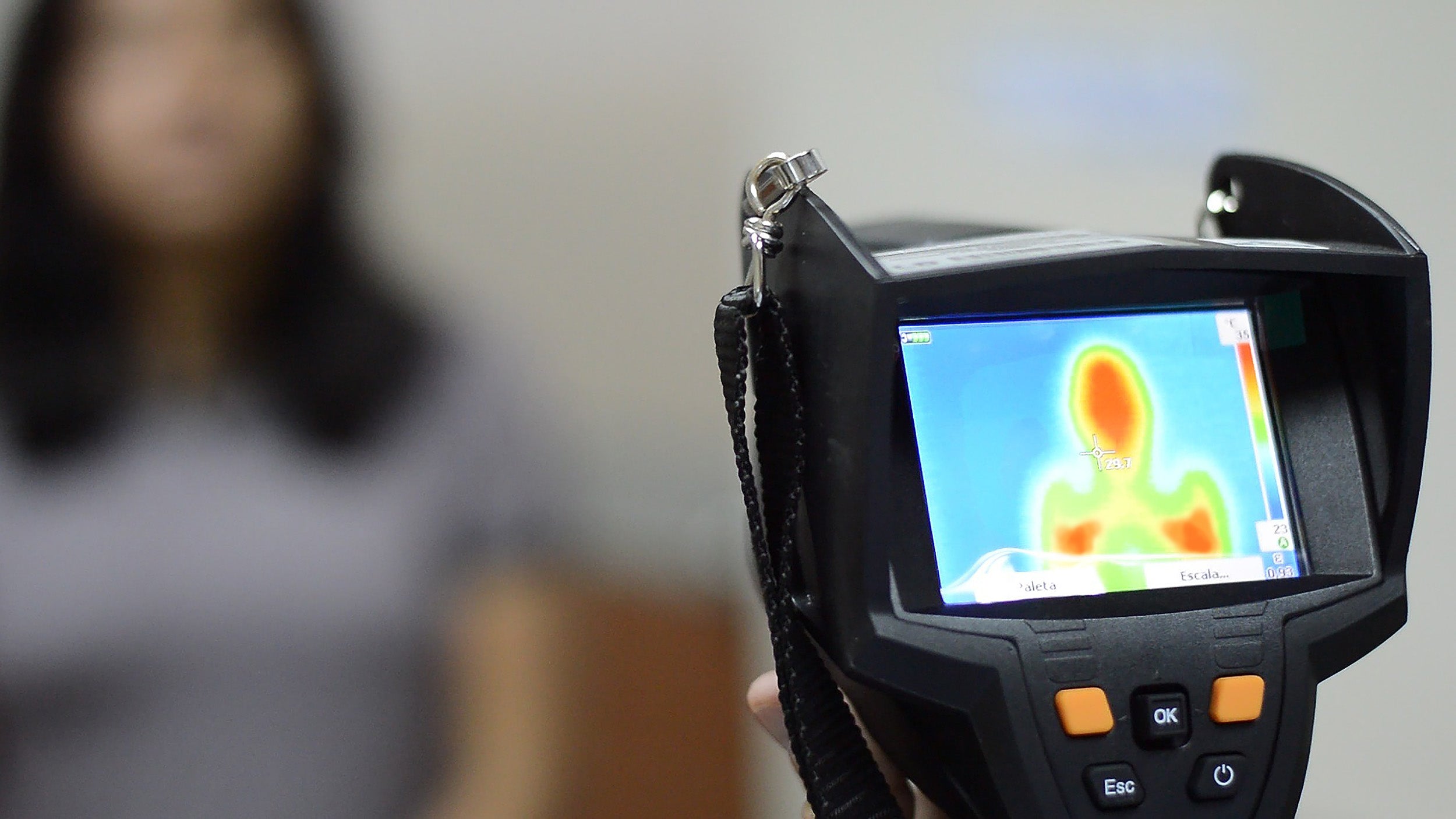 Thermal imaging camera focusing on a person.